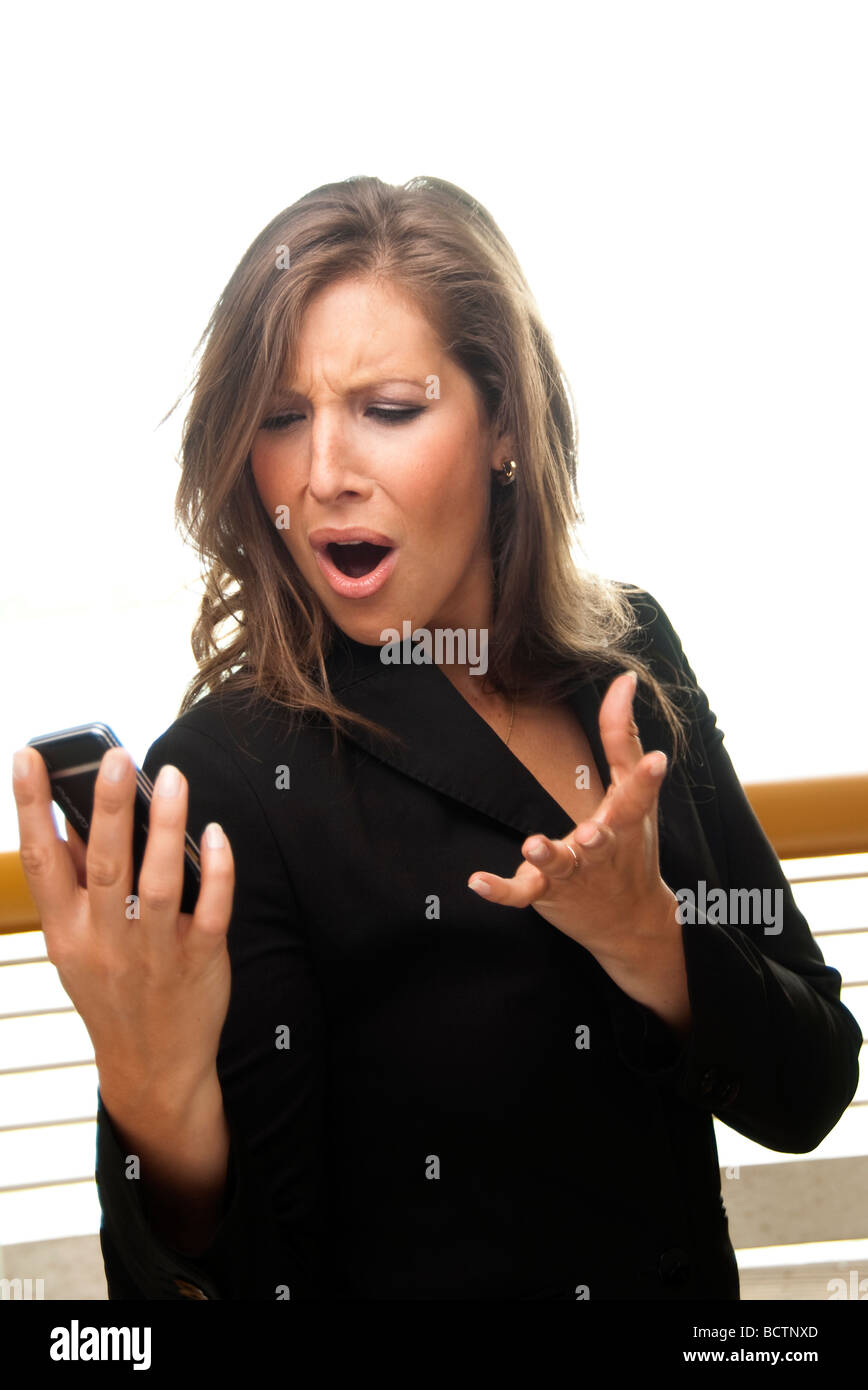 businesswoman with a mobile phone no signal angry Stock Photo