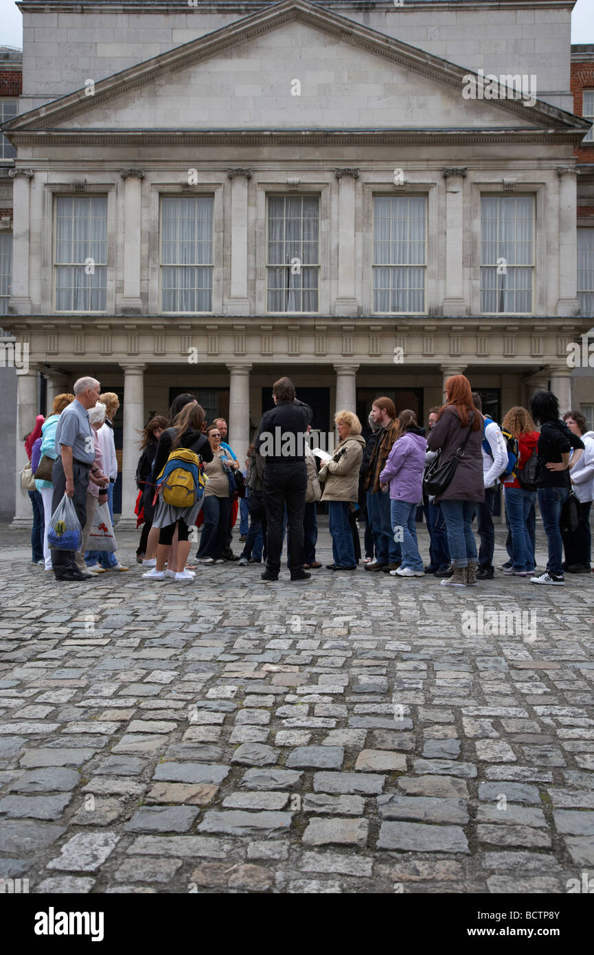 organised tour group of tourists in the the great courtyard upper courtyard in front of the state apartments in dublin castle Stock Photo