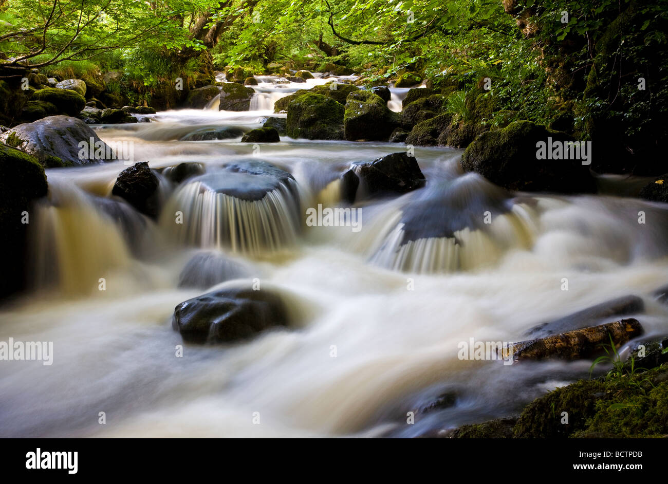 Water flowing in a stream, Aira Beck, just above Aira Force, close to Ullswater in Cumbria, Lake District, England. Now a Unesco World Heritage site Stock Photo
