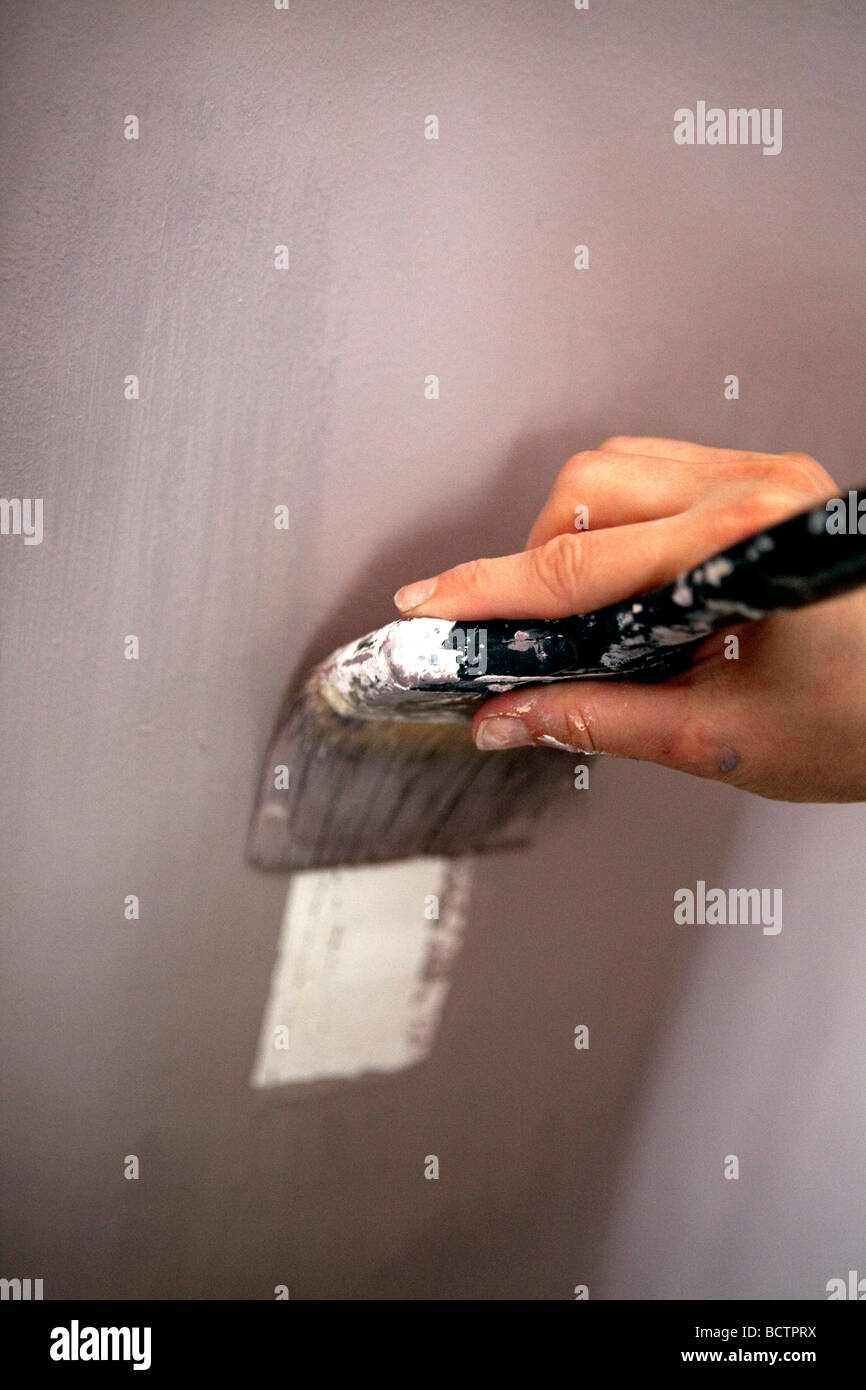Painting a wall Stock Photo