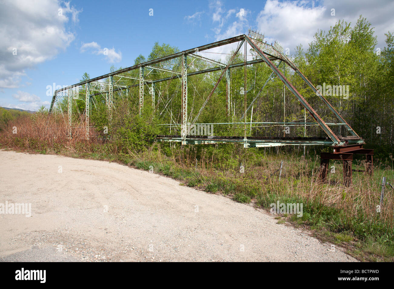 Old Meadows Bridge on the side of the Androscoggin River in Shelburne