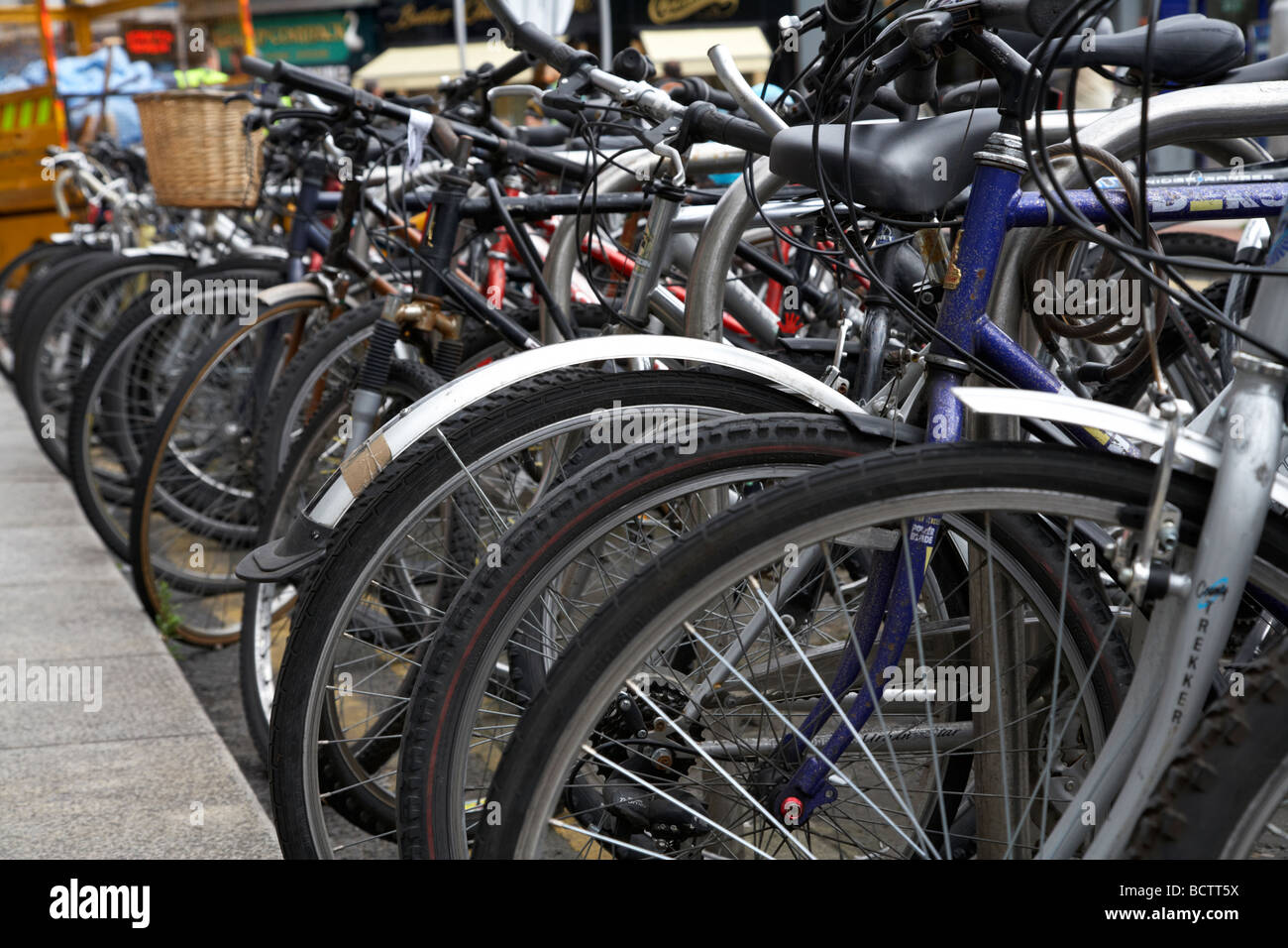 row of bicycles in a bike park in a student area of dublin republic of ireland Stock Photo Alamy
