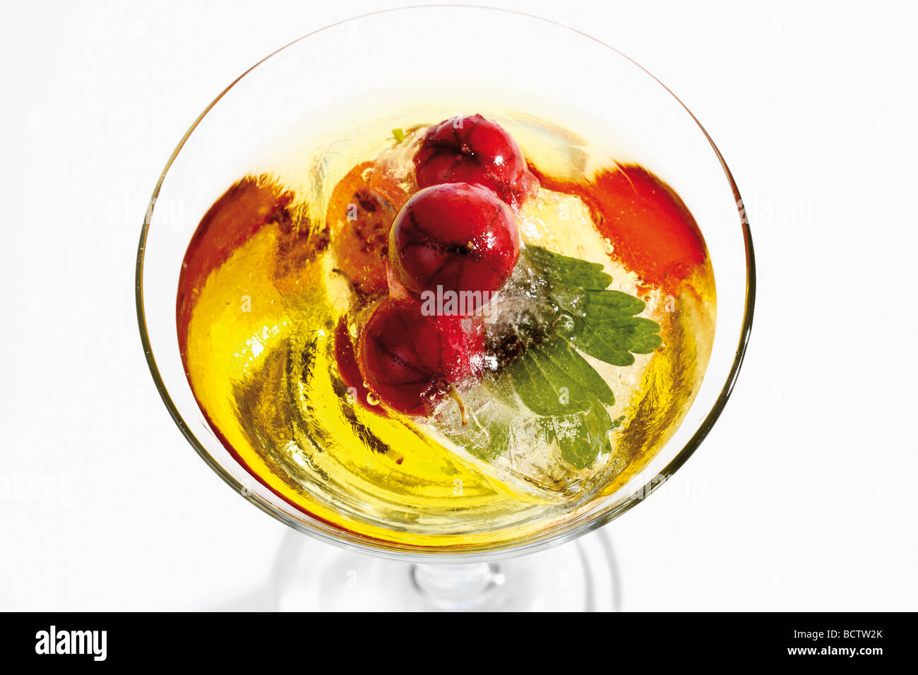 Frozen gooseberries in a drink Stock Photo