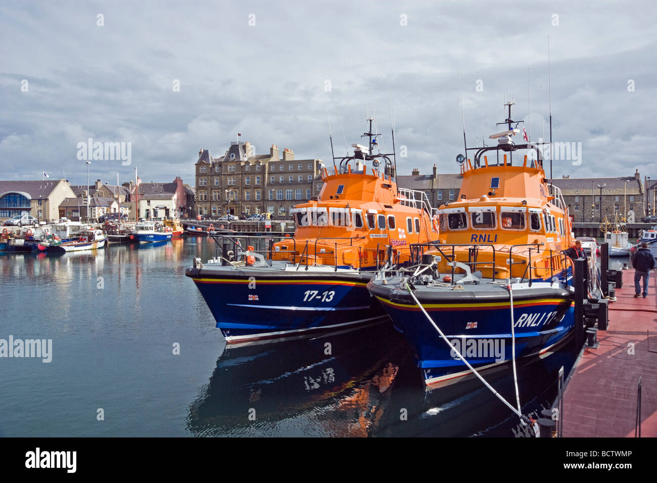 Life boats tied up in Kirkwall harbour on the mainland of Orkney in Scotland Stock Photo