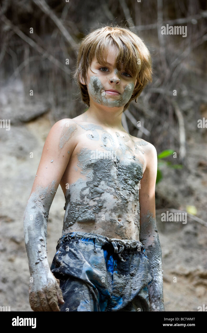 Young boy covered with mud Stock Photo