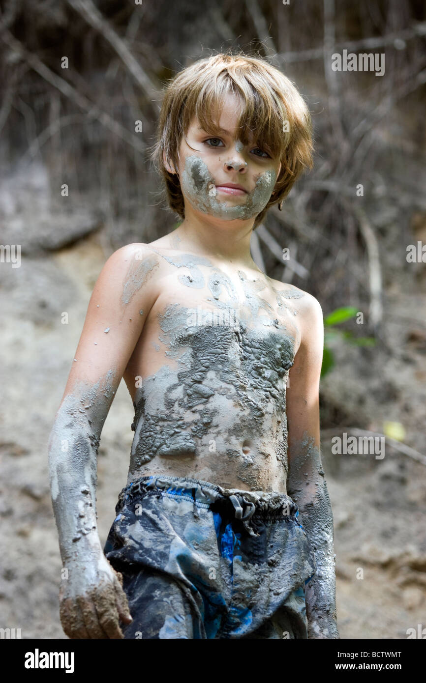 Young boy covered with mud Stock Photo - Alamy