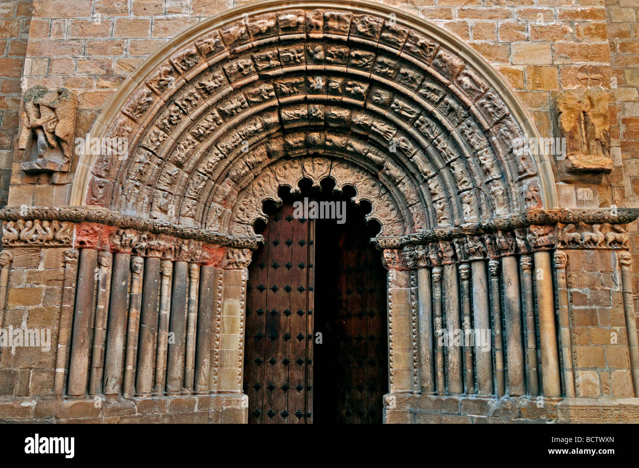 Spain, St. James Way: Romanesque portal of the church Iglesia de Santiago in Puente la Reina Stock Photo