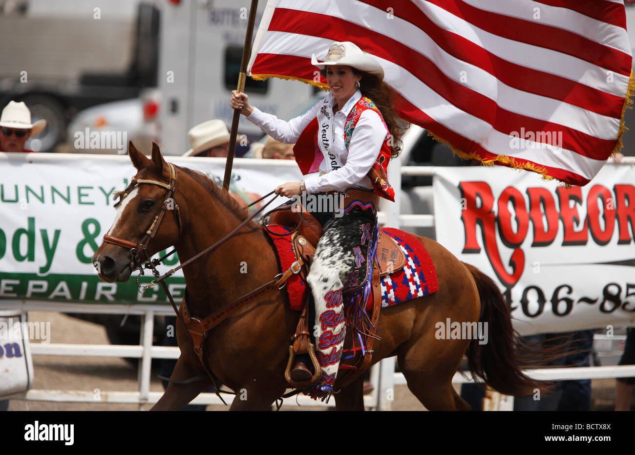 Courtney Smith, Miss Rodeo South Dakota, presents the American flag ...