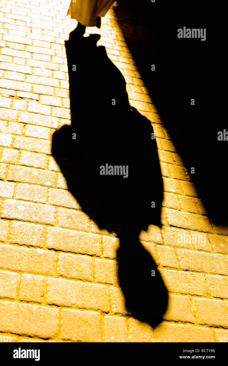 Shadow of man on street Stock Photo - Alamy