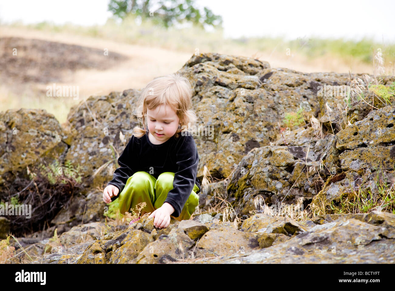 Girl discovering small plants Stock Photo
