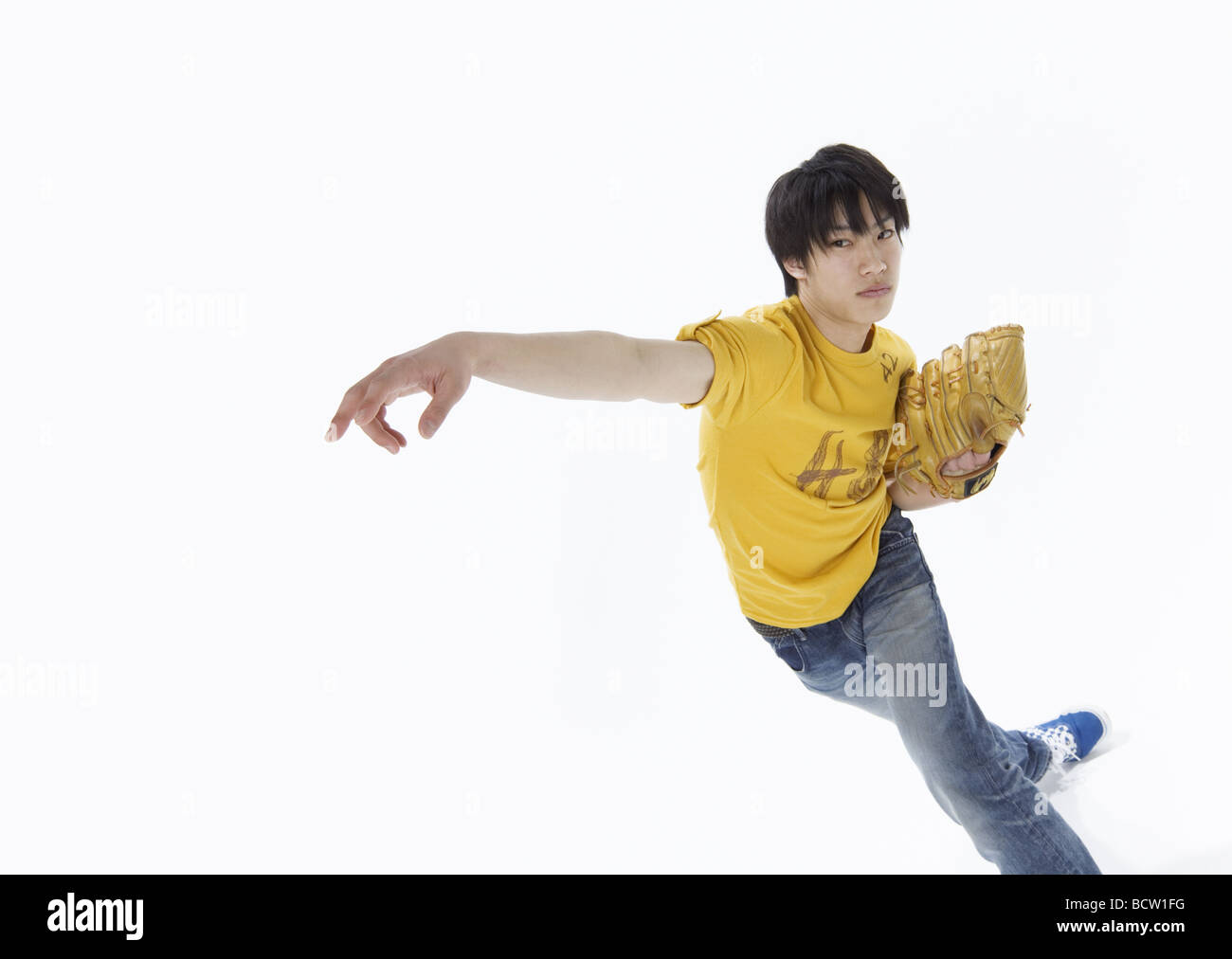 Young man playing baseball Stock Photo - Alamy