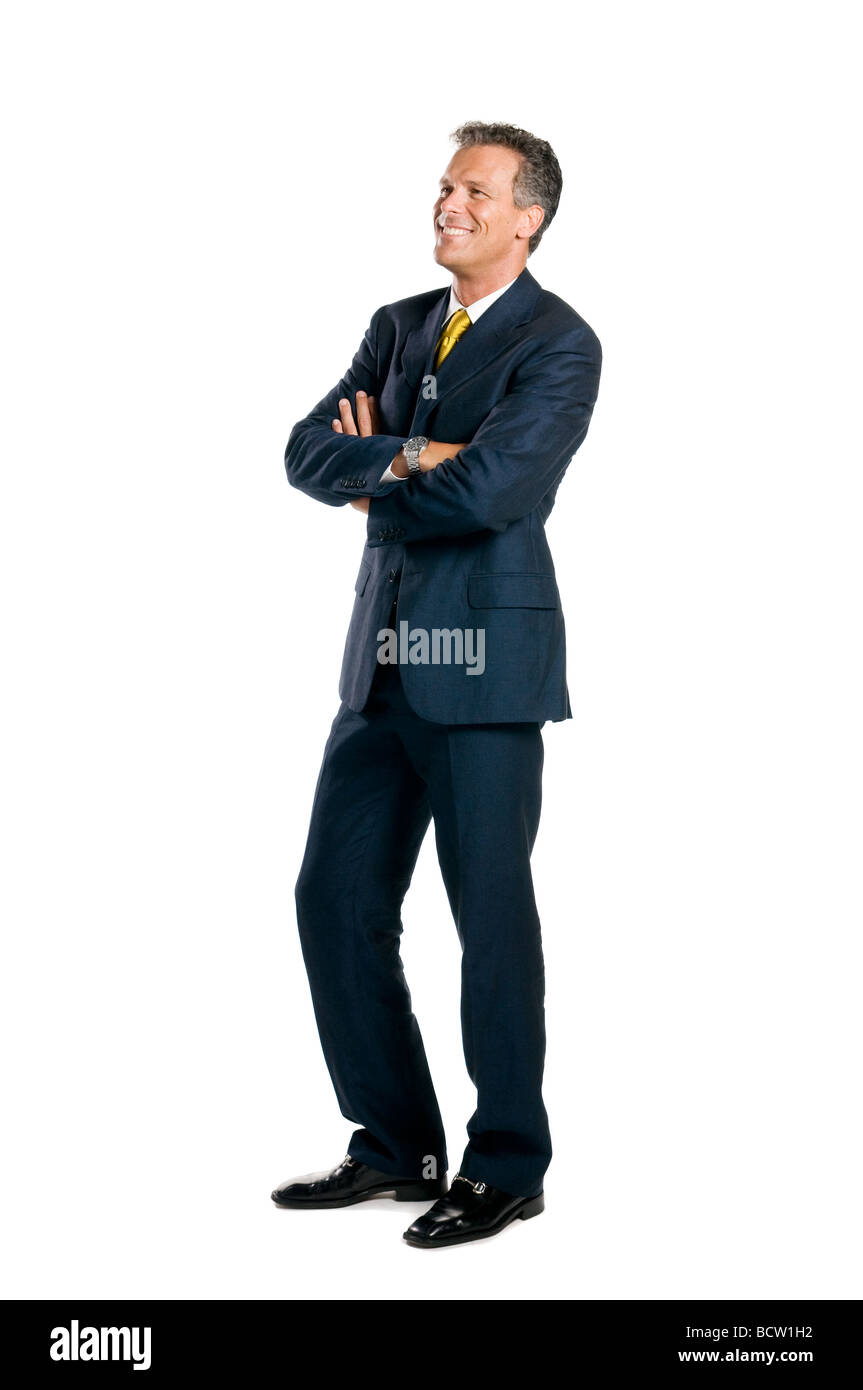 Smiling businessman standing full length with crossed arms isolated on ...