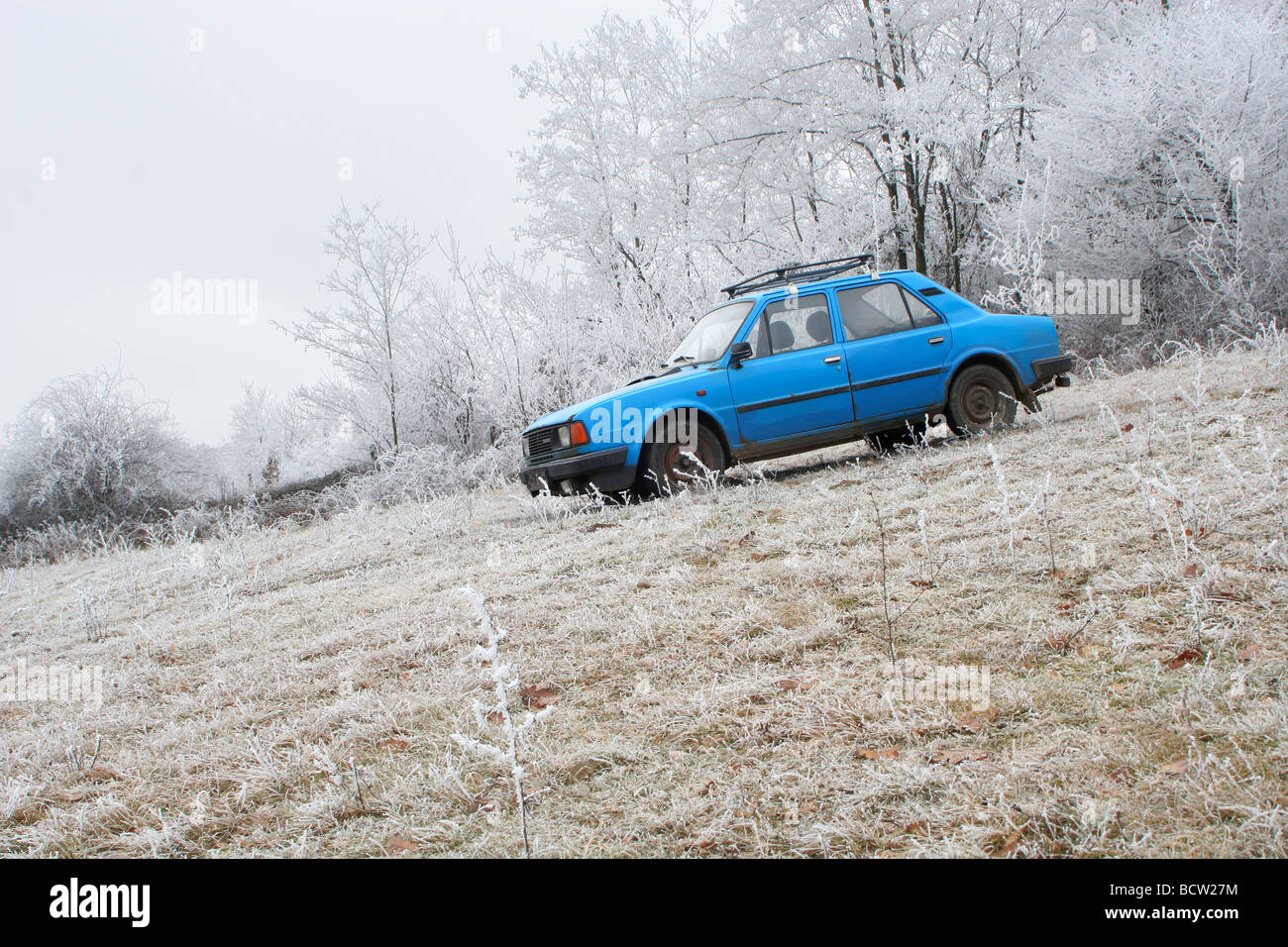 old blue car in winter Stock Photo
