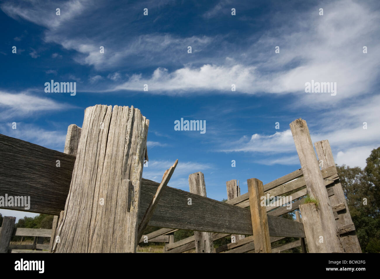 Old wooden stockyard fence with blue sky and clouds Stock Photo - Alamy