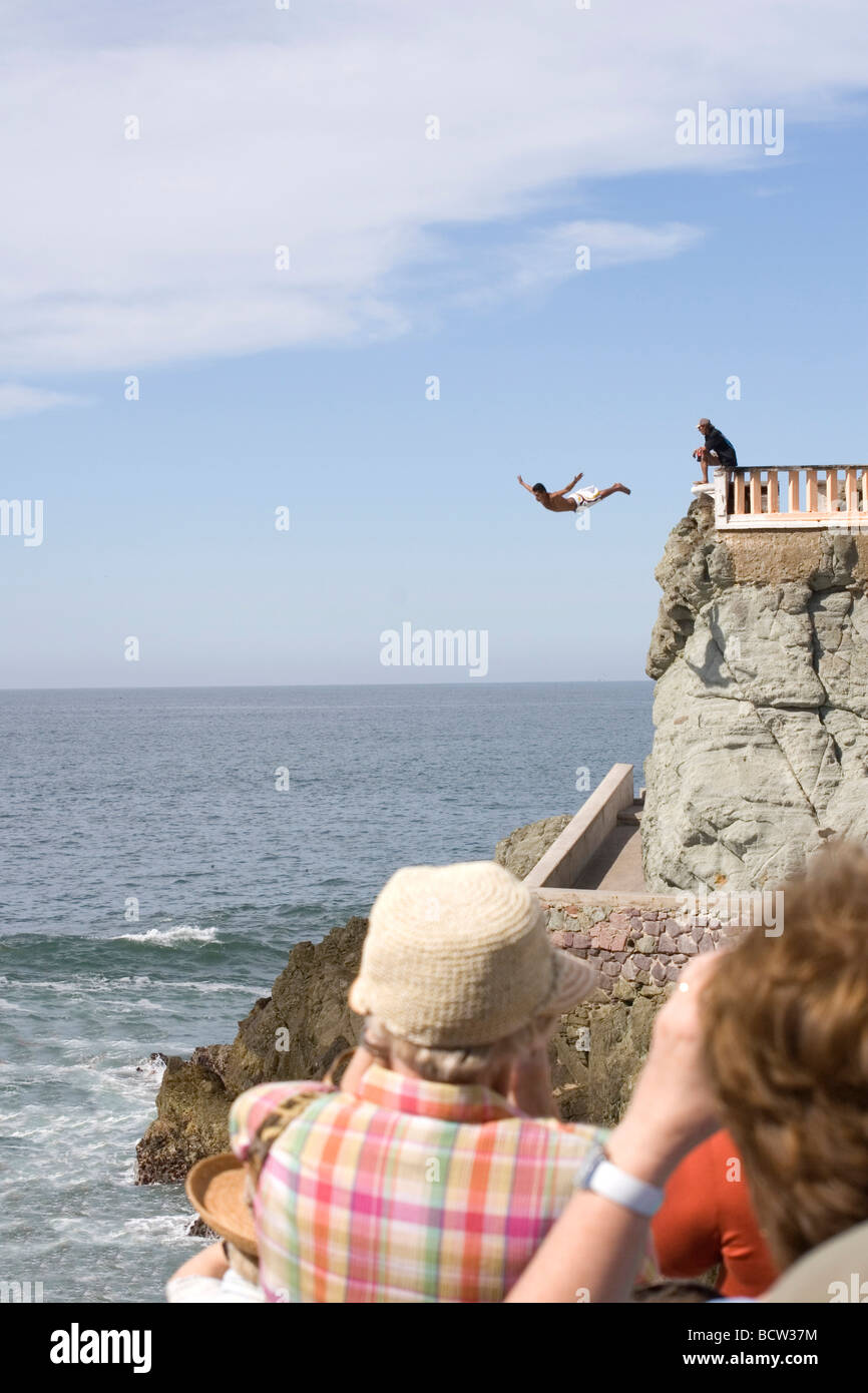 Person diving from a cliff into the sea, Olas Altas Beach, Mazatlan