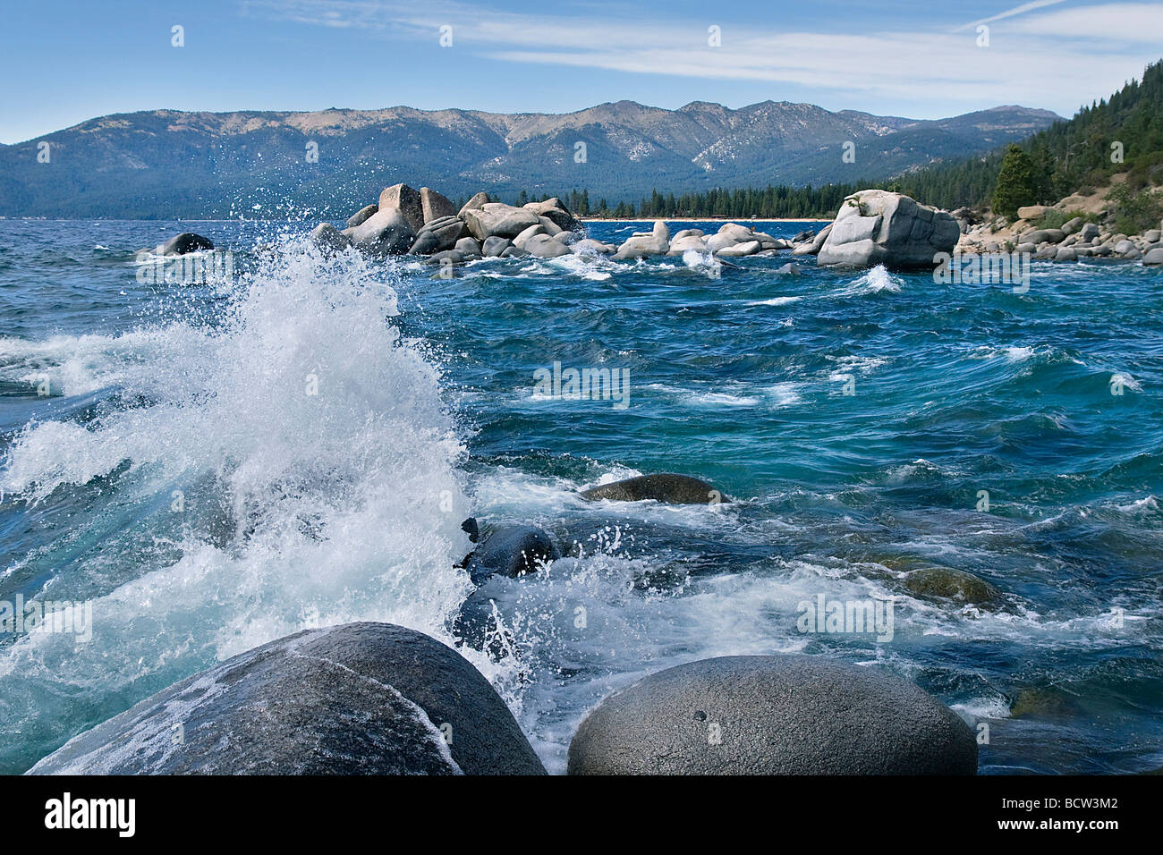 Waves breaking on rocks in a lake, Lake Tahoe, Californian Sierra Nevada, California, USA Stock Photo