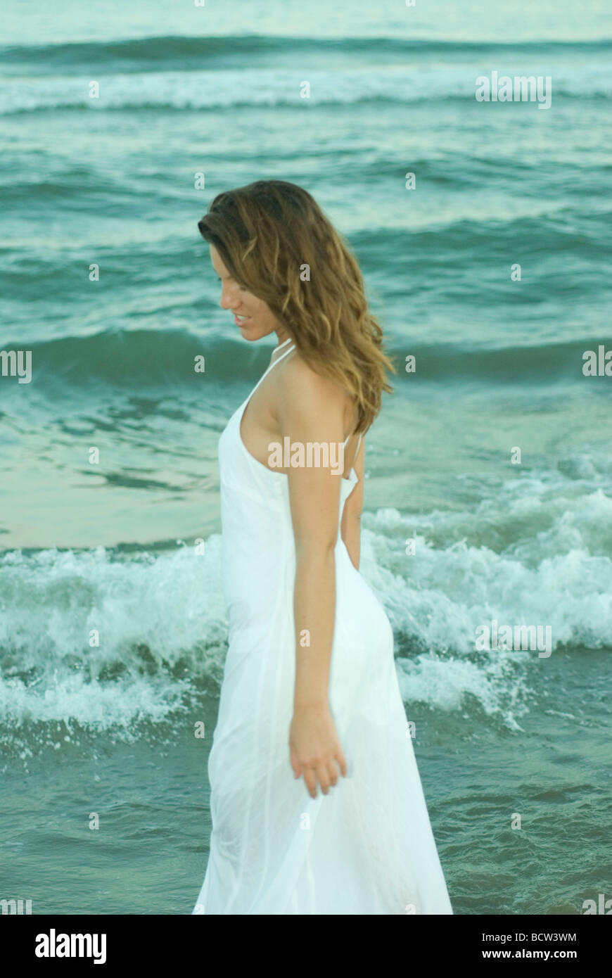 young woman on with white dress on the beach Stock Photo Alamy — free download