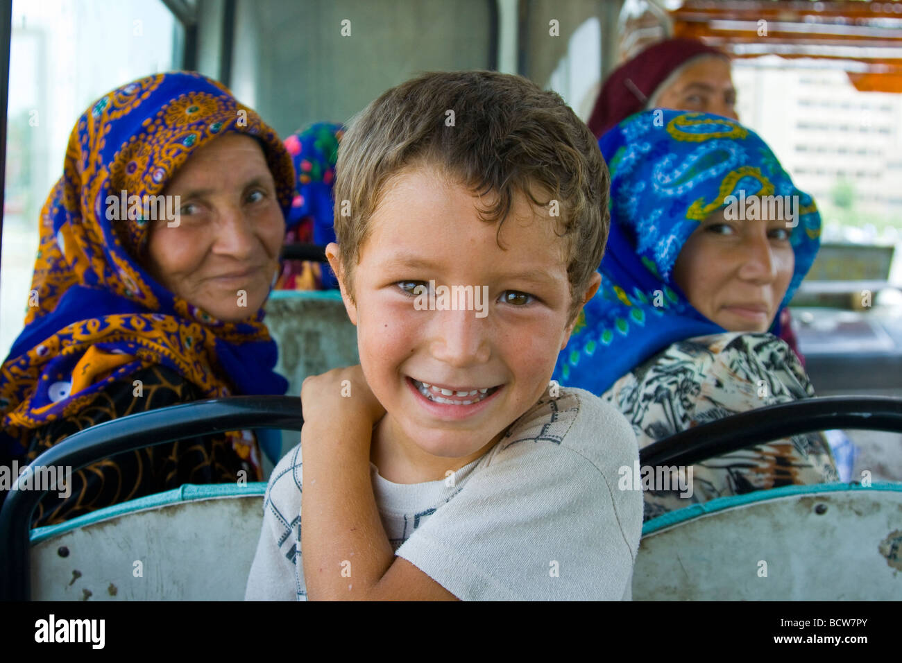 Muslim Women and Young Boy on a Bus in Mary Turkmenistan Stock Photo