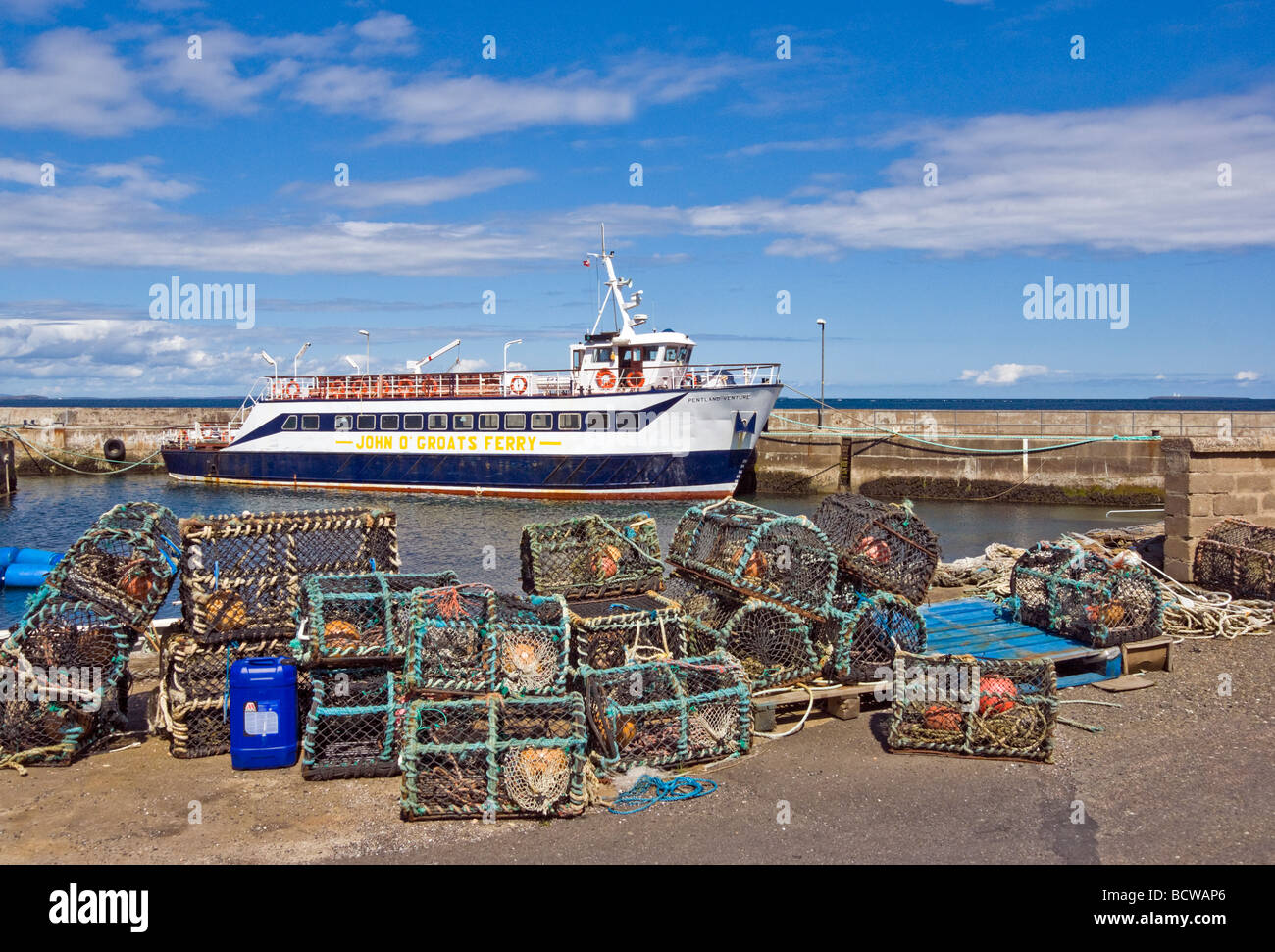Passenger vessel Pentland Venture moored in John O' Groats harbour between local cruises and providing a ferry service to Orkney Stock Photo