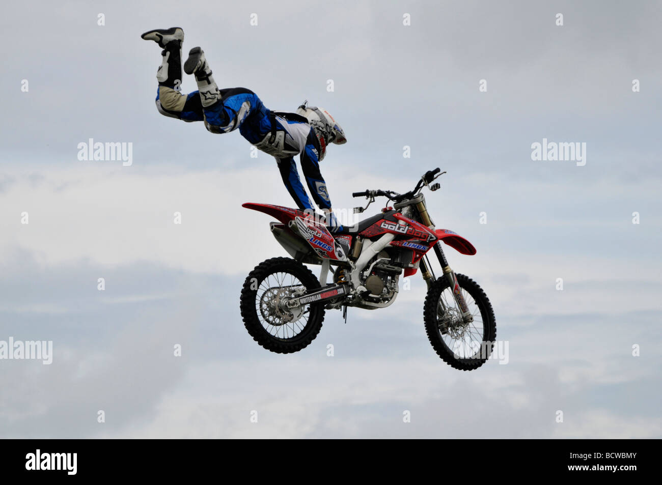 Motorcycle stunt rider flying through air at a show Cromer Norfolk England  Stock Photo - Alamy