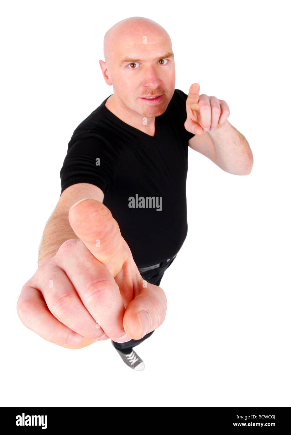 bald headed man is pointing his forefingers at the camera Stock Photo