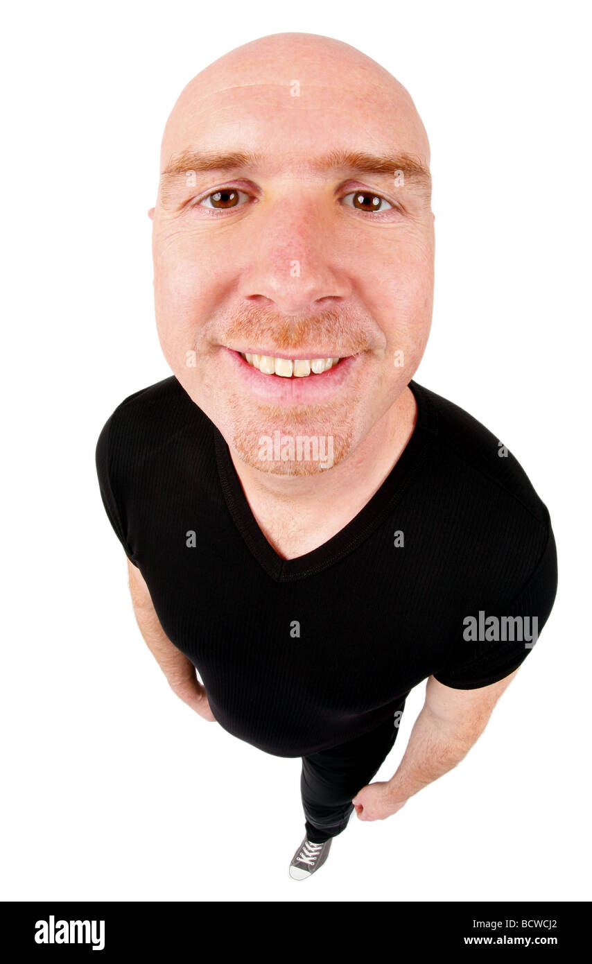 bald headed man grinning  into the camera Stock Photo