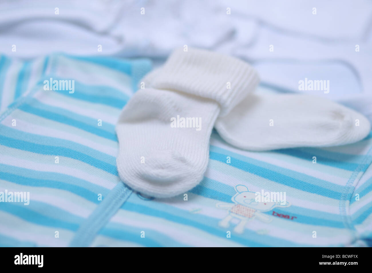 Close up of baby boy socks and sleepsuit Stock Photo Alamy
