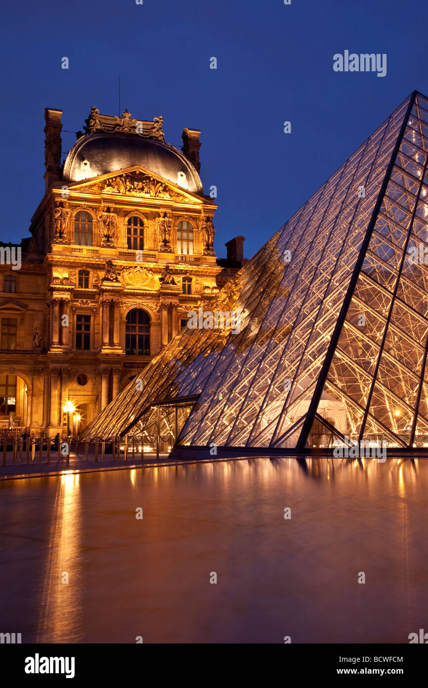 Courtyard of Musee du Louvre at twilight, Paris France Stock Photo