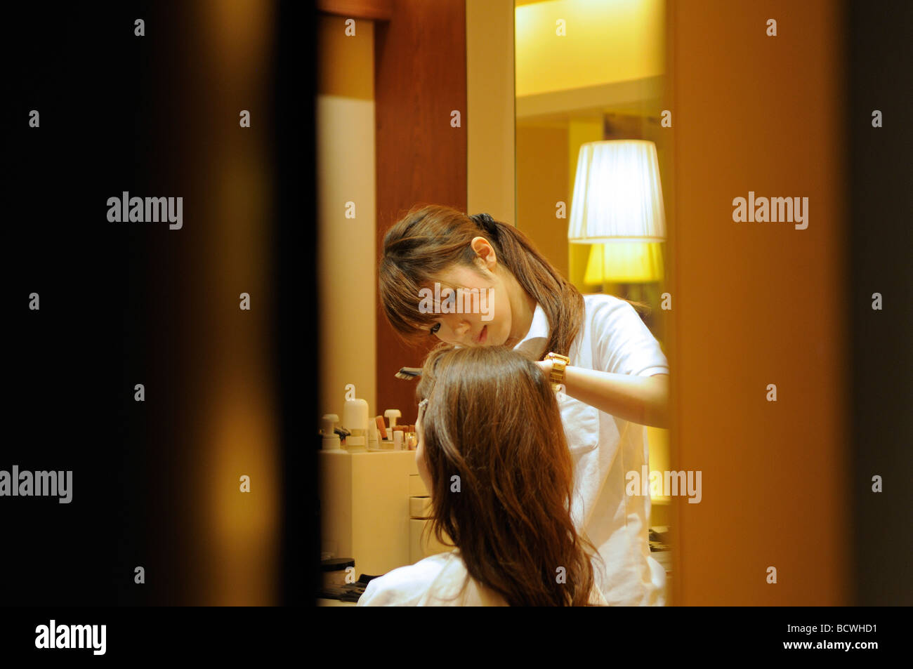 Young woman getting facial in beauty parlour in Roppongi Hills Central Tokyo Tokyo Stock Photo