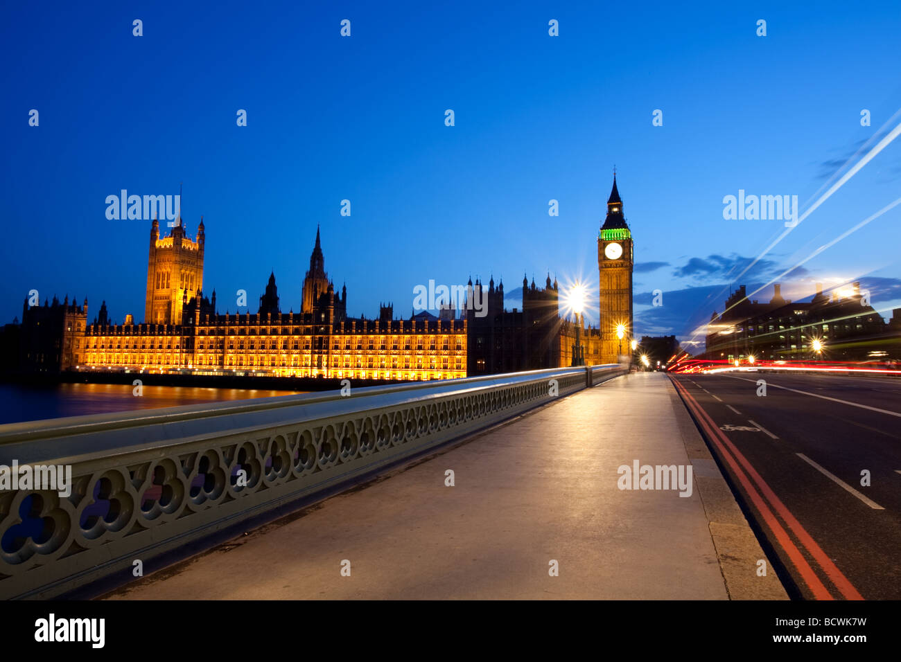 The Houses of Parliament with traffic light streams on Westminster bridge. Stock Photo