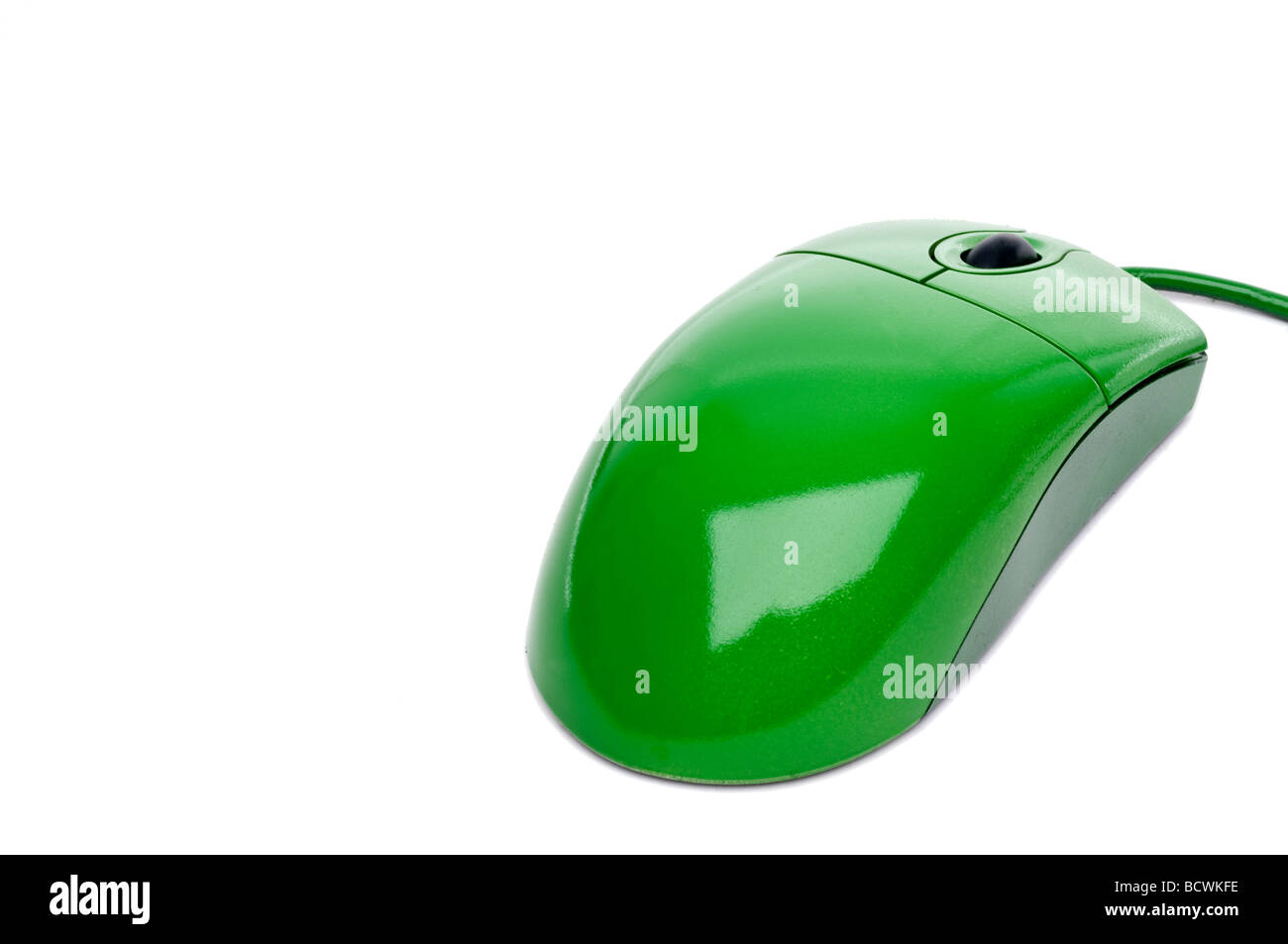 horizontal close up of a green computer mouse on white with copy space Stock Photo