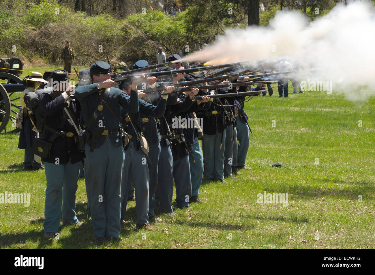 Union soldiers shoot rifles during a reenactment of the US Civil War in