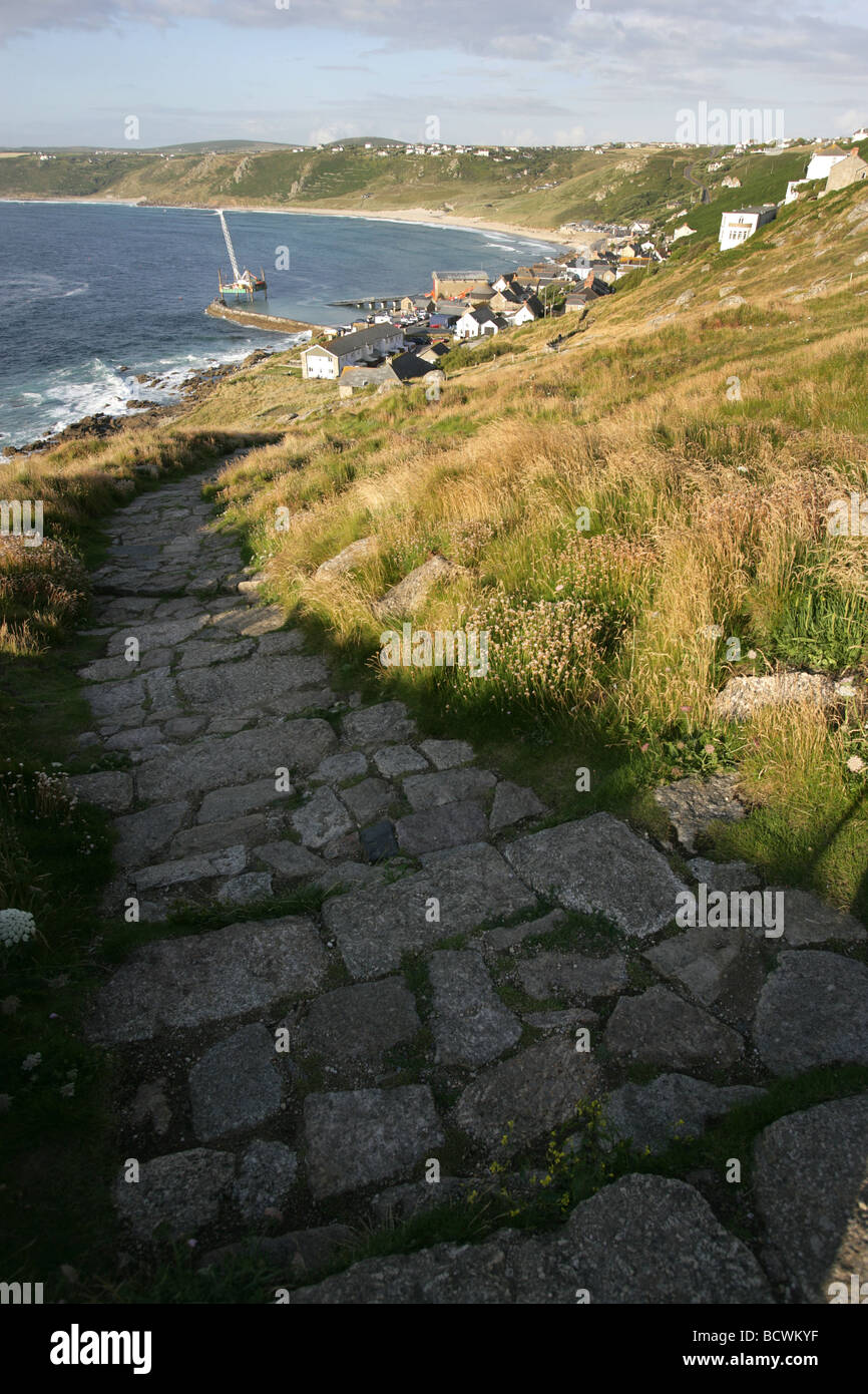 Area of Sennen, England. Coastal path leading from Pedn-men-du cliff into Sennen Cove Harbour. Stock Photo