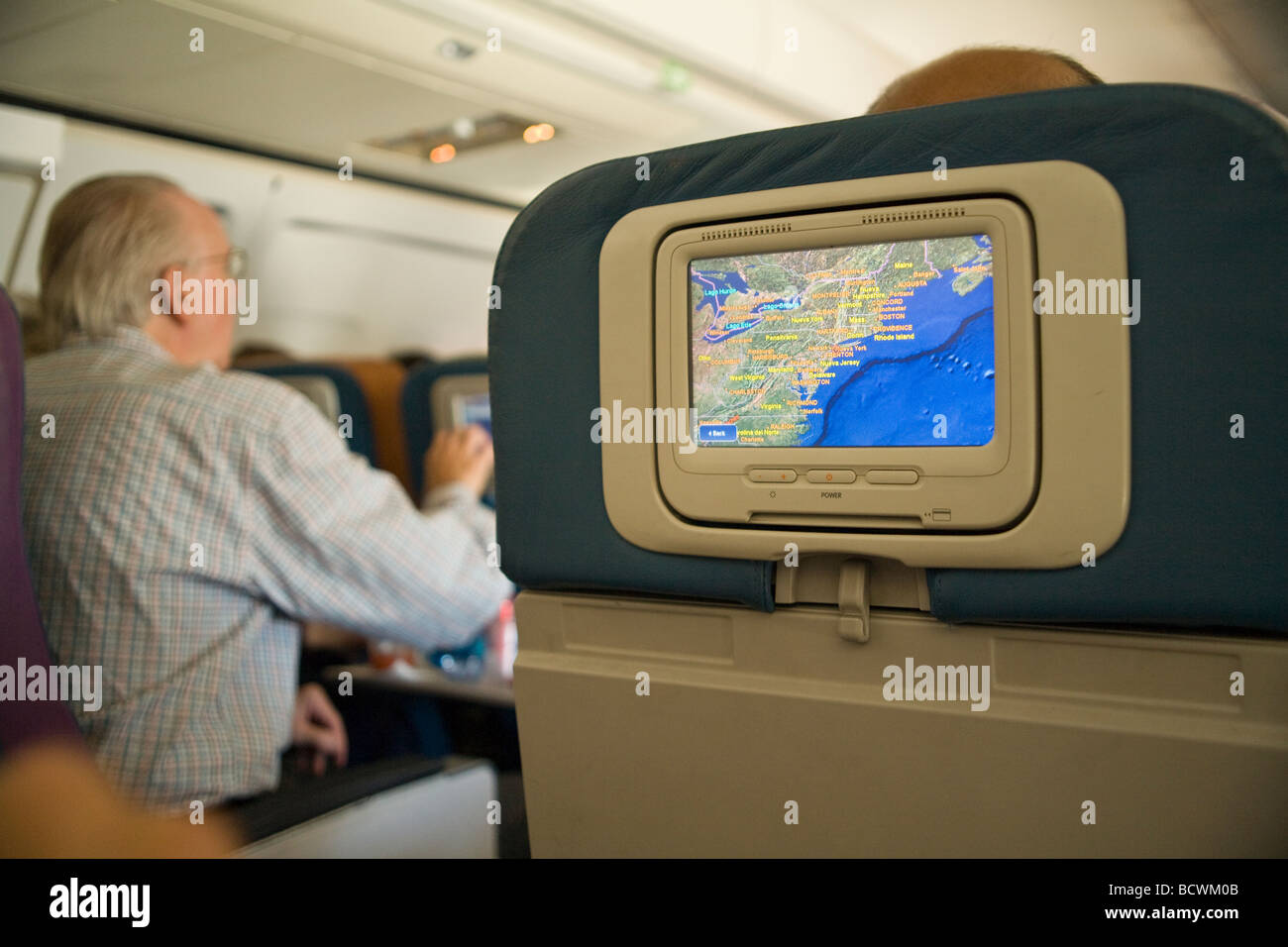 Personal video monitor on back of seat of Delta Airlines plane Stock