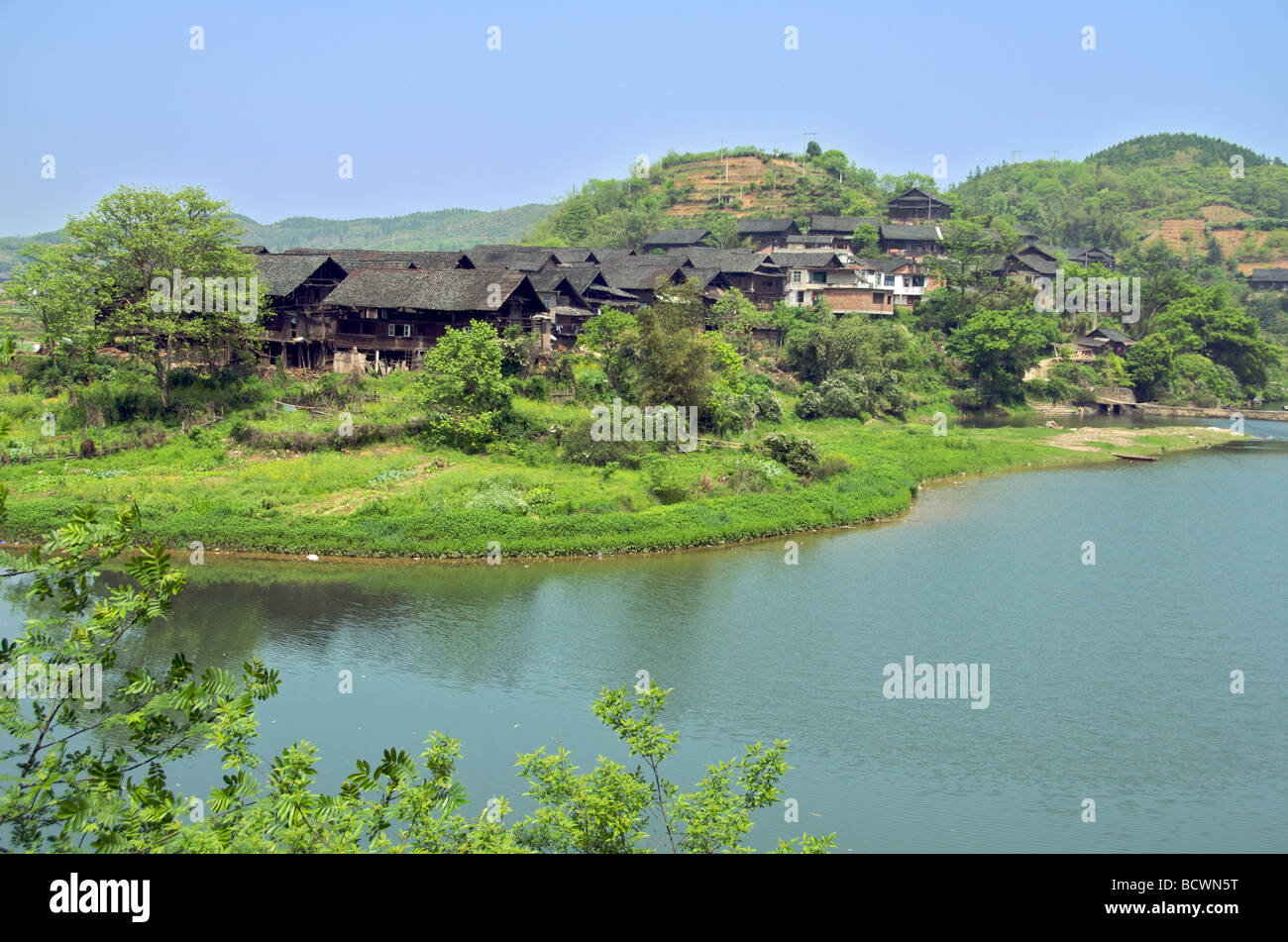 Dong village on river near Sanjiang Guangxi Province China Stock Photo