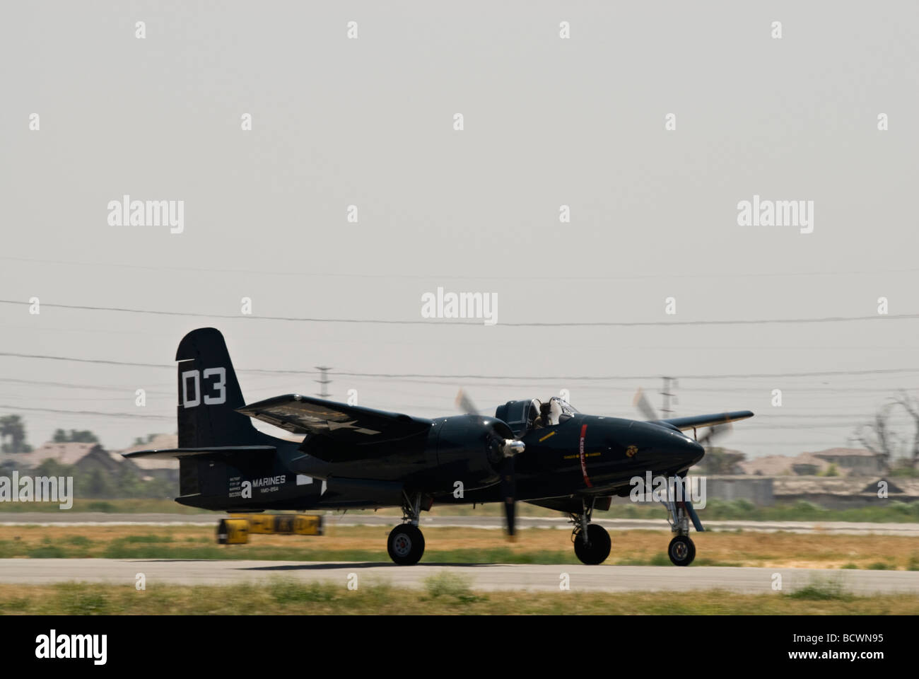 A Grumman Tigercat taxis on the runway Stock Photo