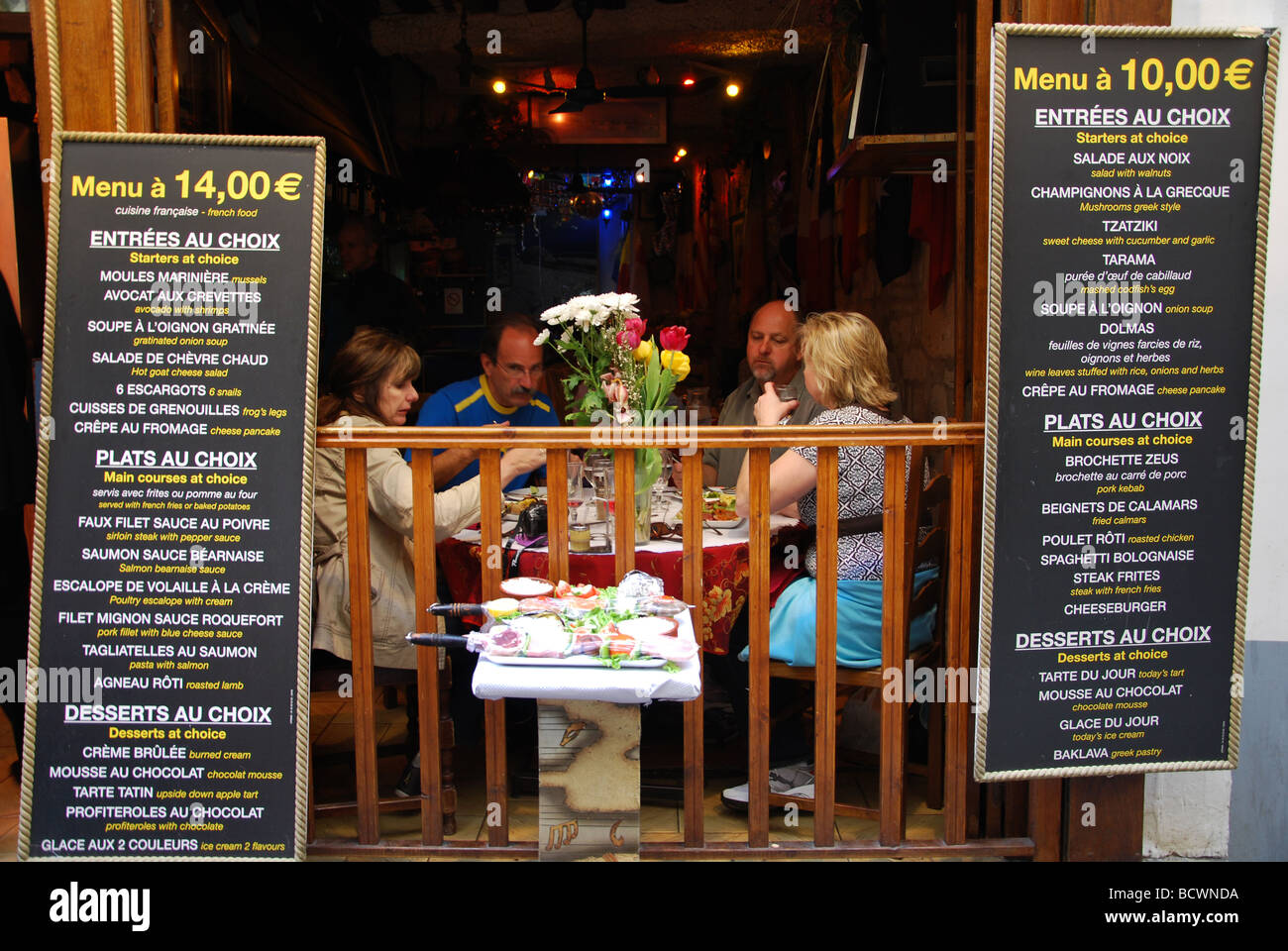 family having a meal at Parisian restaurant, Paris France Stock Photo