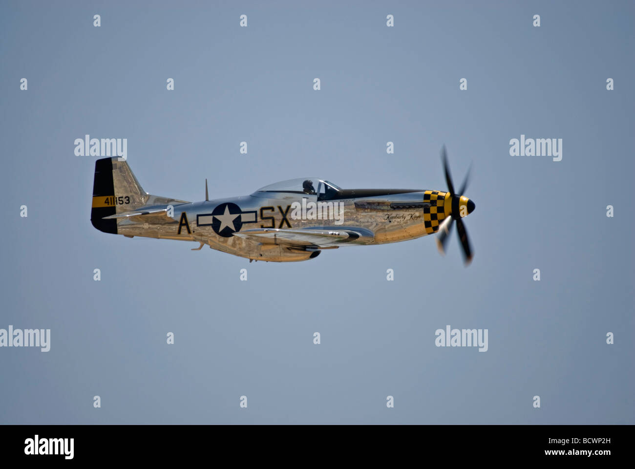 A P-51 Mustang flys at an airshow. Stock Photo