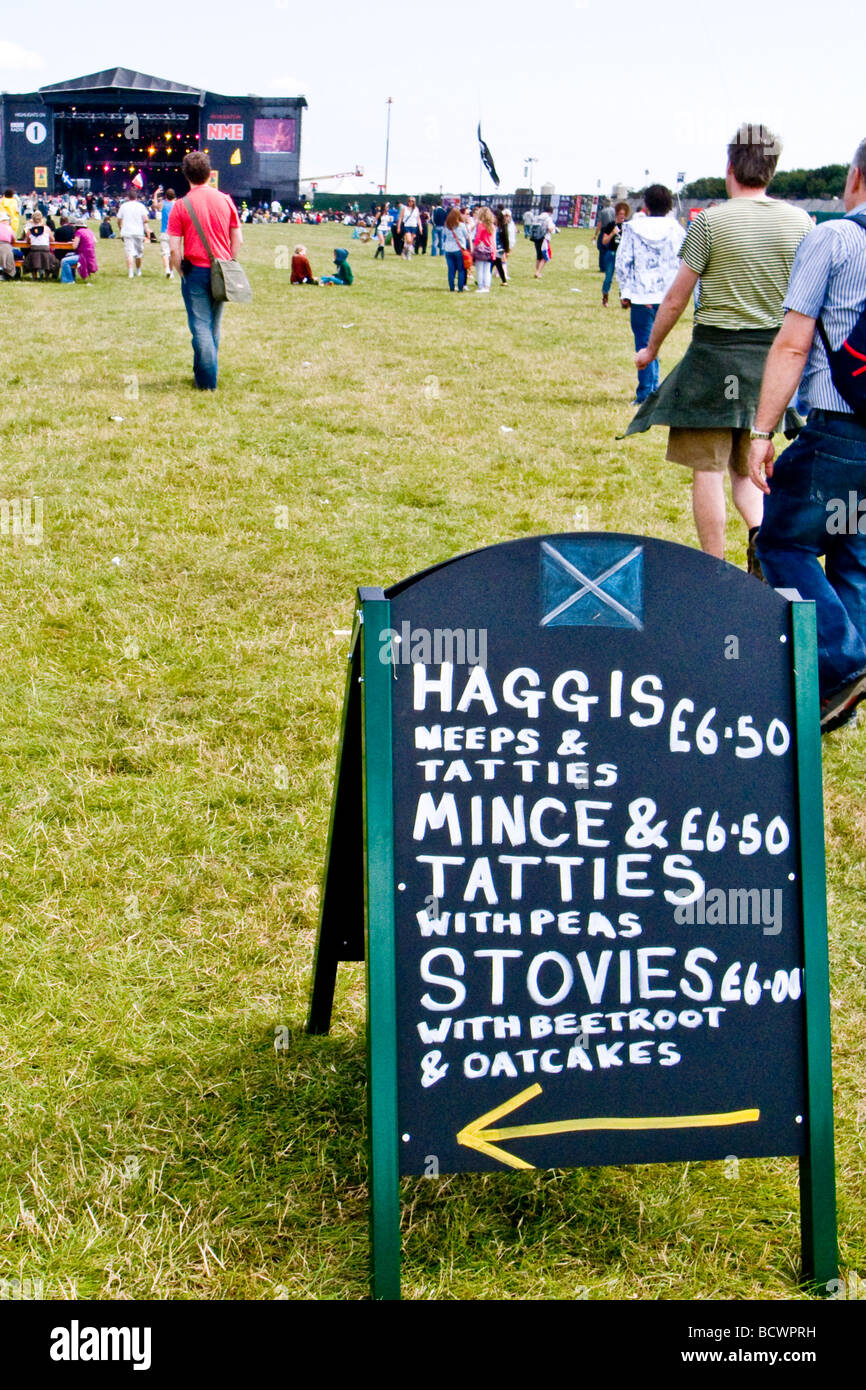 A sign advertising traditional scottish food - Haggis, neeps, tatties and stovies -   near the NME stage at the T in the Park fe Stock Photo