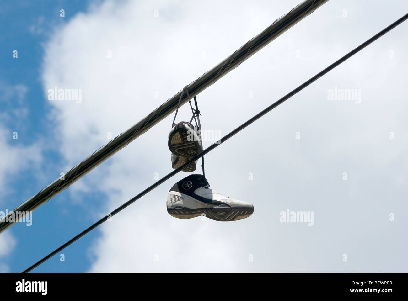 Shoes hanging on power line hi-res stock photography and images - Alamy
