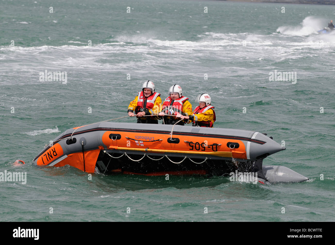 Righting a capsized boat Stock Photo Alamy