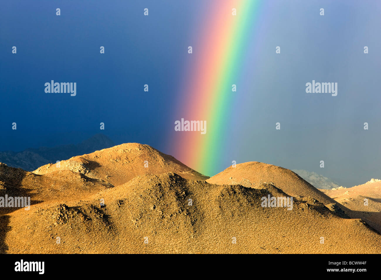 Rainbow over Eastern Sierra Mountains near Bishop California Stock Photo