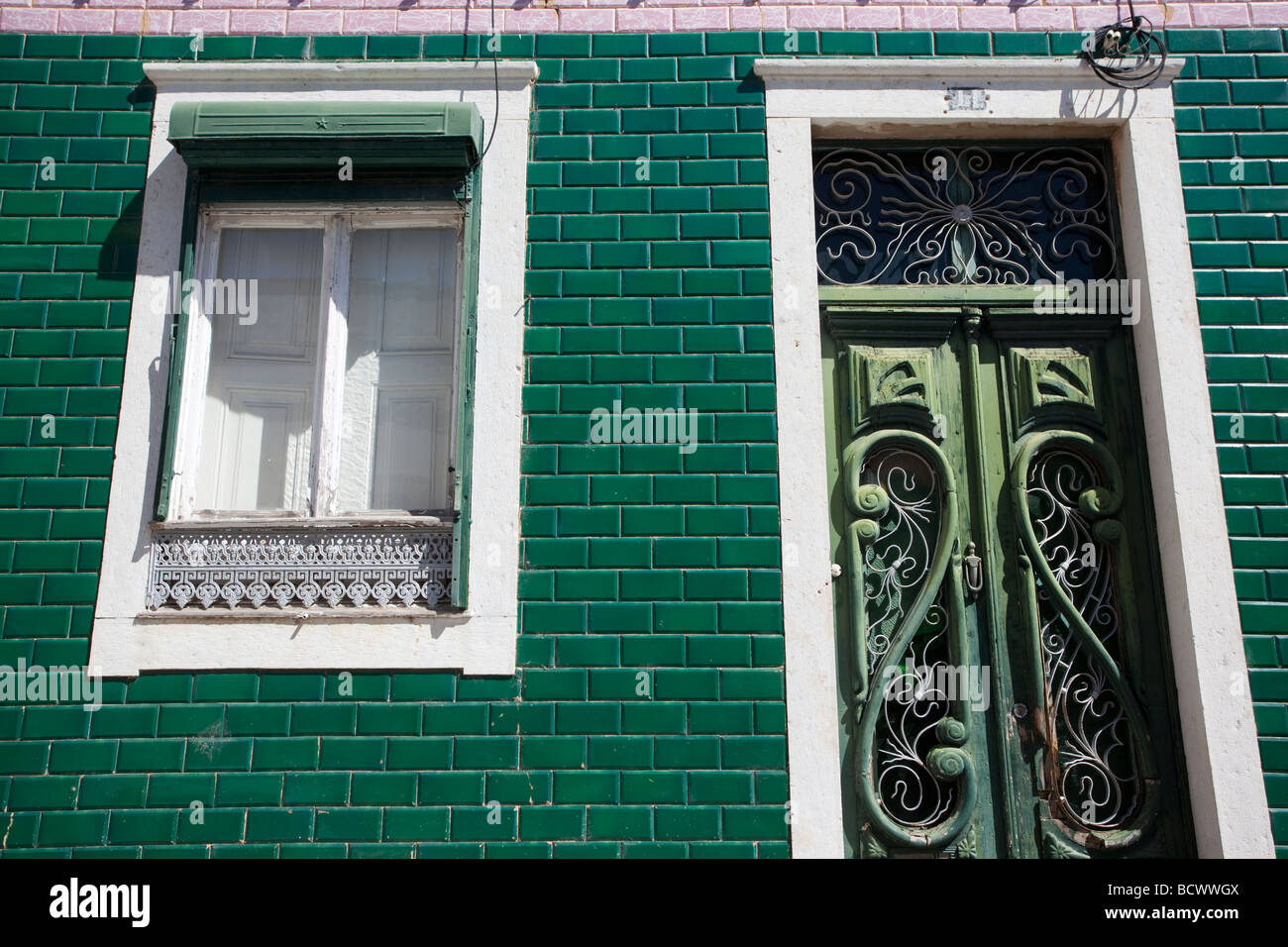 Houses with green tiles in Faro, Portugal Stock Photo