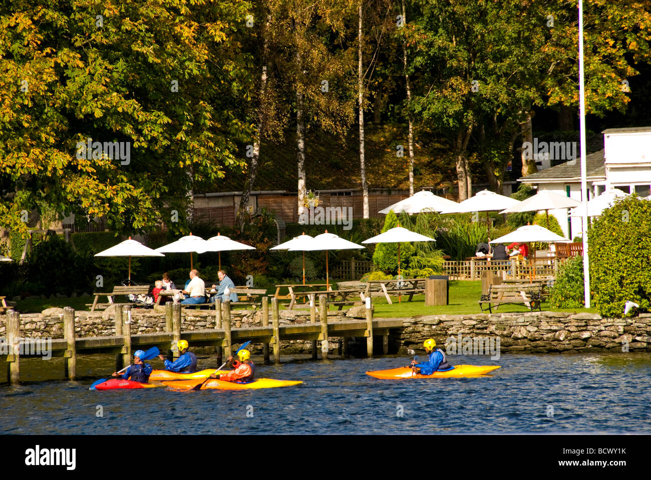 Kayakers on Lake Windermere, Lake District, UK, fall color Stock Photo