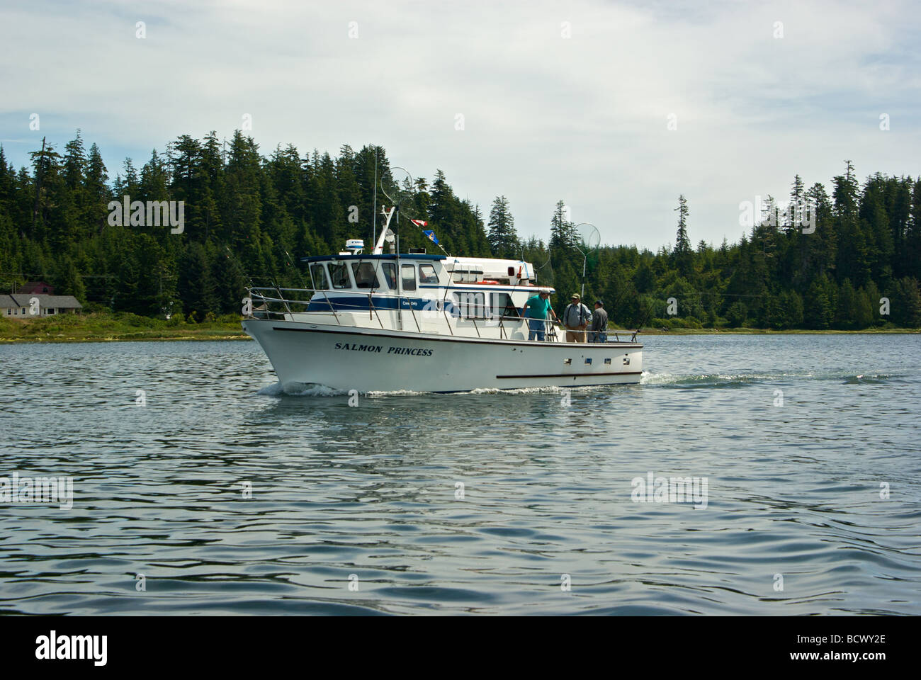 Drift jigging party charter boat returning to Ucluelet port after morning of fishing in open Pacific Ocean Stock Photo