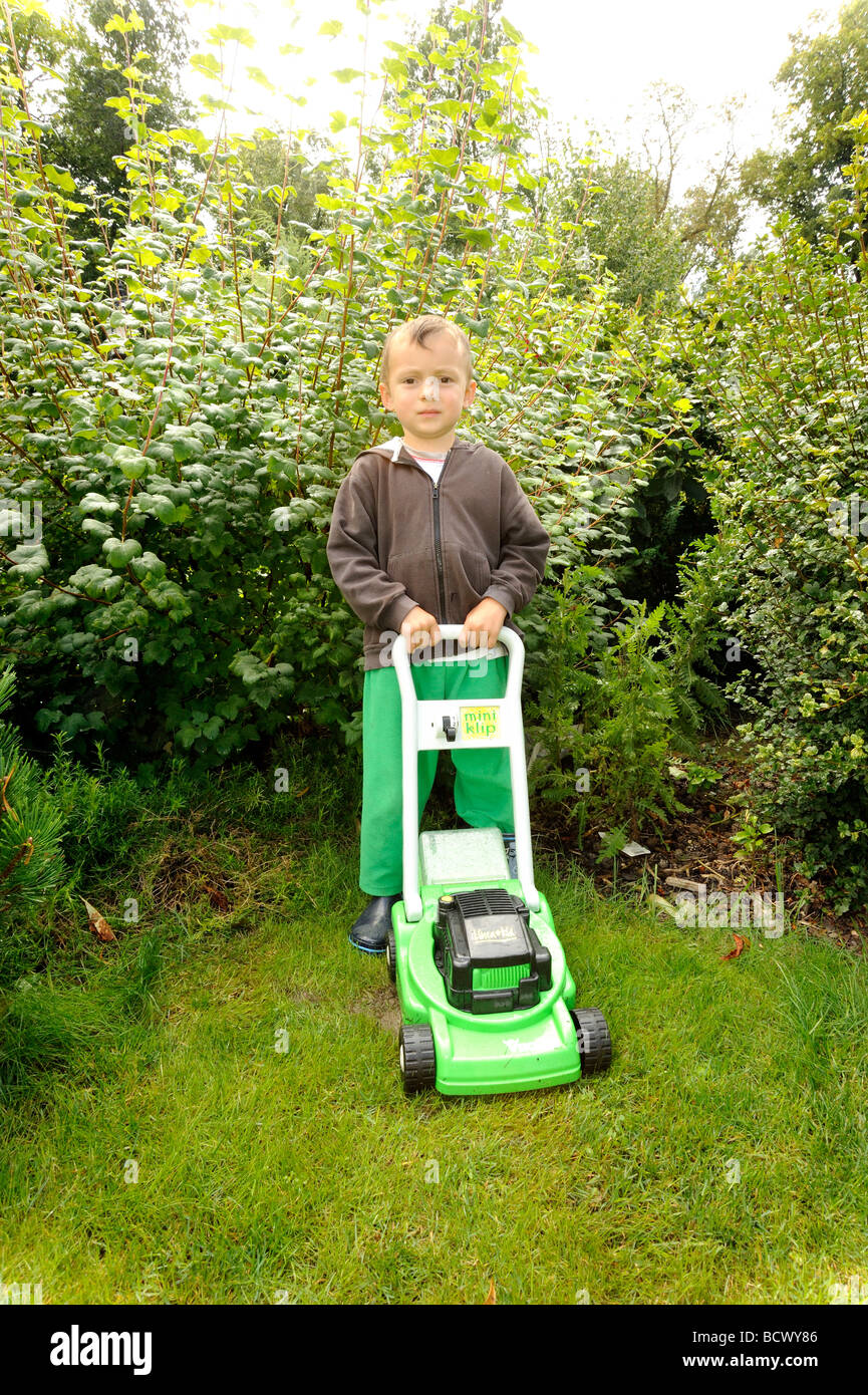 Children cutting grass hi-res stock photography and images - Page 2 - Alamy