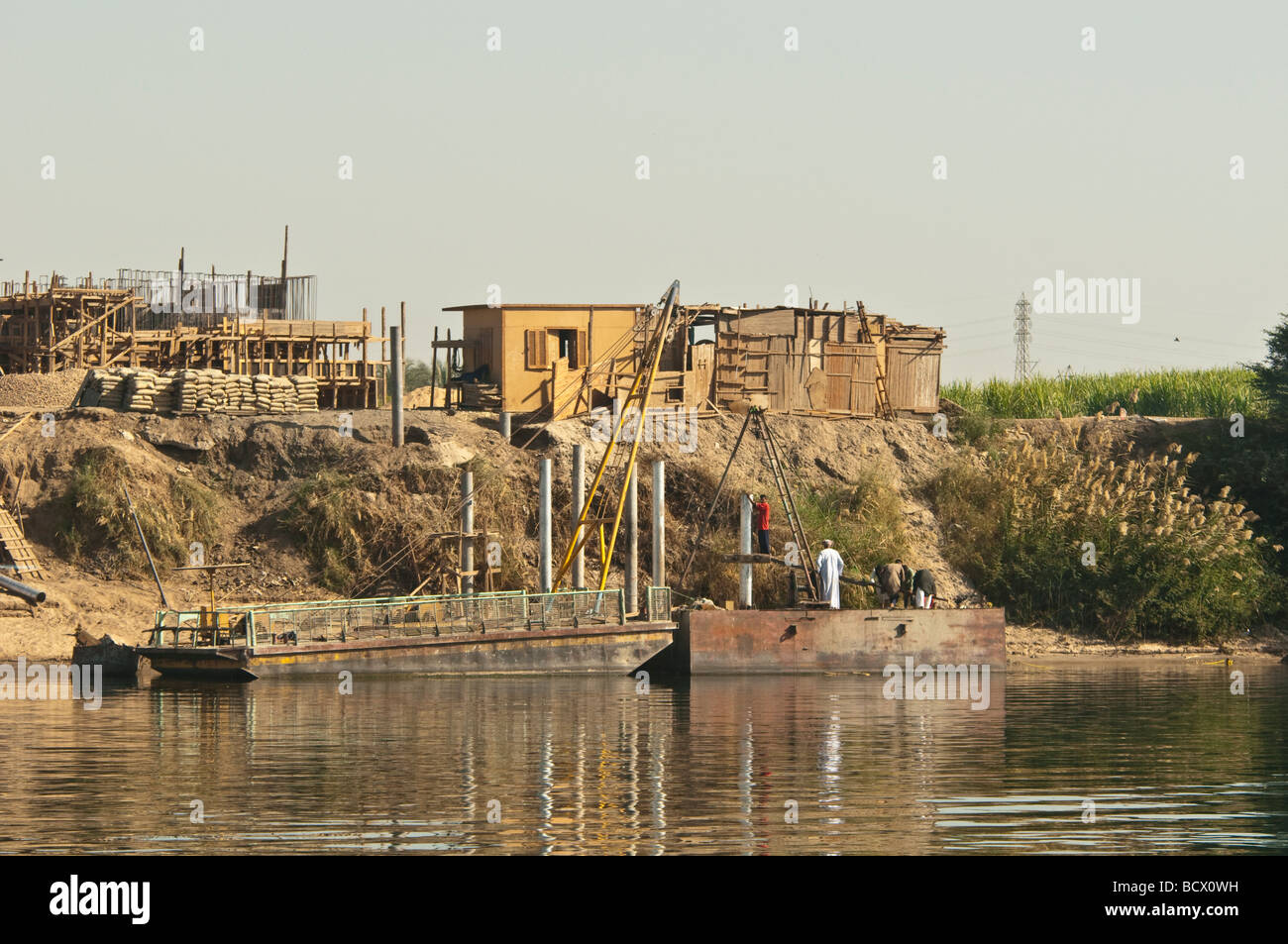 Egypt Kom Ombo Nile River barge and building Stock Photo