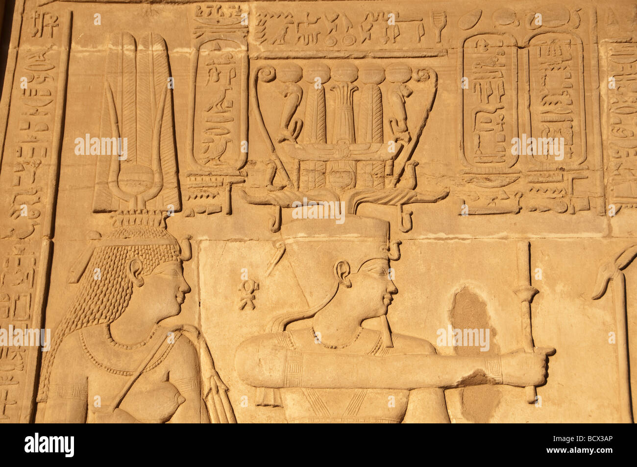 Egypt Kom Ombo temple wall pharaoh queen portraits closeups faces crowns Stock Photo