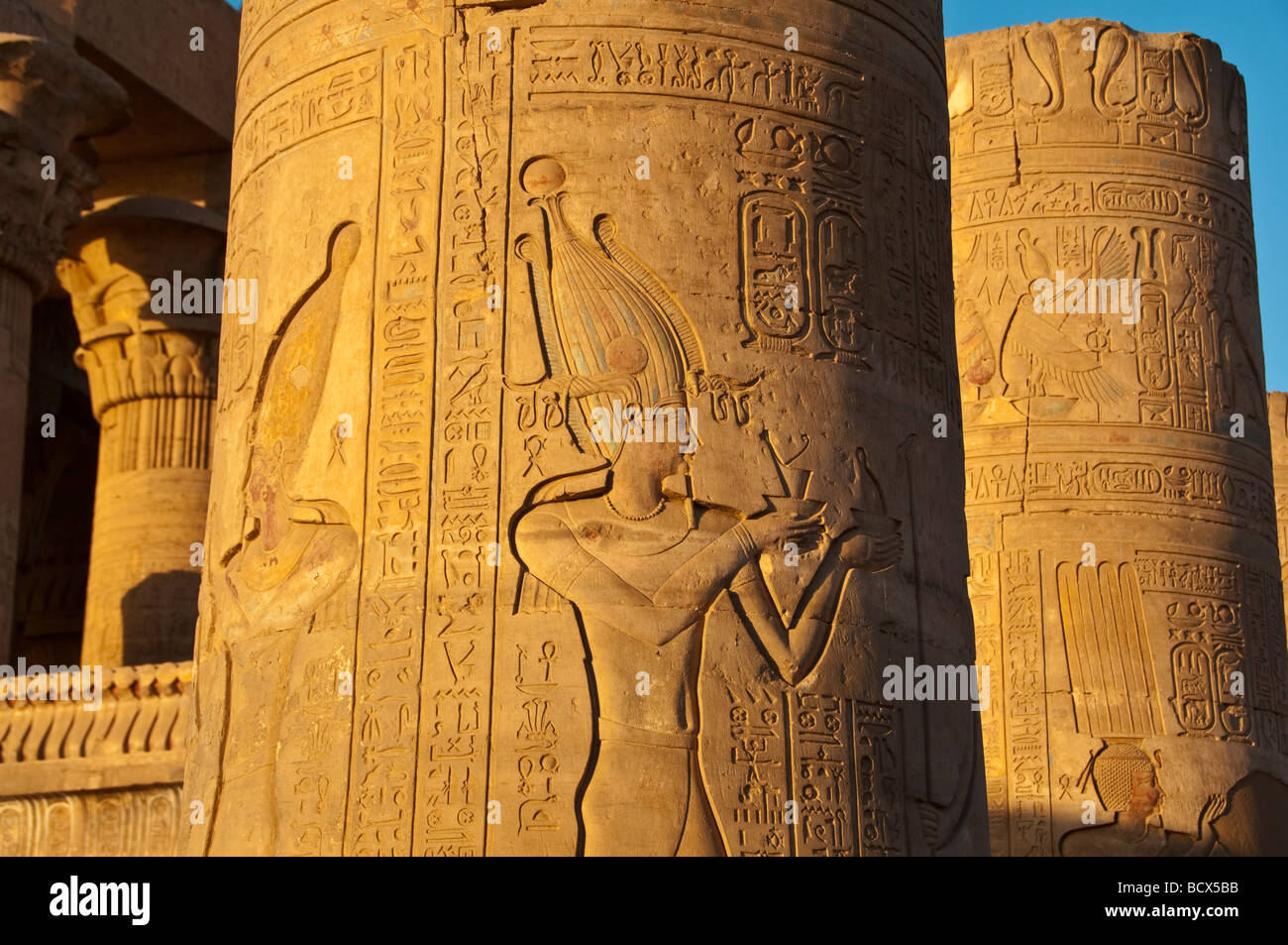 Egypt Kom Ombo row of outdoor pylons or columns showing  pharaoh king honoring the gods Stock Photo