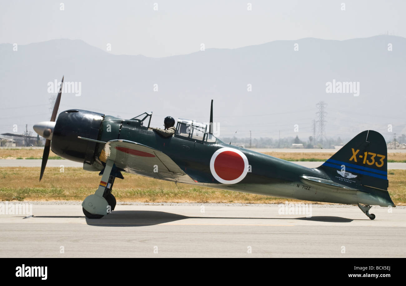 A Mitsubishi A6M5 Zero fighter taxis after flying at an air show.  One of only 3 or 4 airworthy Zero fighters in the world. Stock Photo